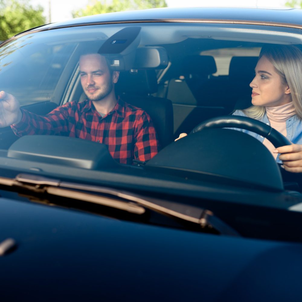 lady-and-male-instructor-in-car-driving-school.jpg