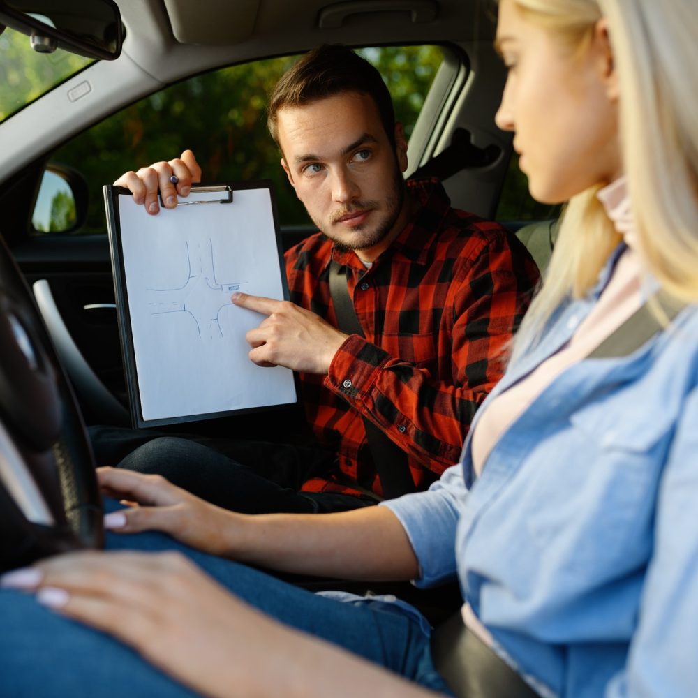 woman-and-man-with-checklist-driving-school-1.jpg